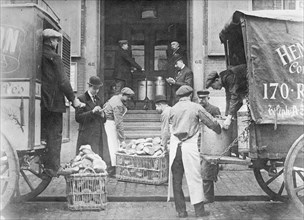 Workers delivering food to a municipal food kitchen in Belgium. ca.  between 1910 and 1920