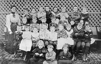 Miss Dyer school group, children group photo, arms crossed ca.  between 1910 and 1935