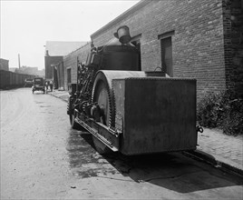 Equipment of the Crawford Paving Company, paving a road ca.  between 1910 and 1925