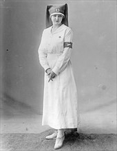 American Red Cross uniform modeled by a Red Cross nurse. ca.  between 1910 and 1920