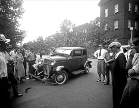 Street scene, witnesses to an auto accident ca. between 1910 and 1935