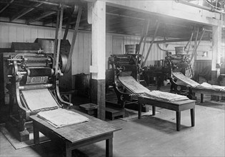 Printing presses. Printing the sugar containers at the C&H Sugar Company factory ca.  between 1910 and 1920