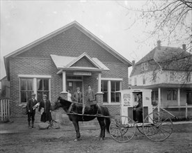 Mailman in a horse drawn mail truck, outside the Vienna VA post office ca.  between 1910 and 1935