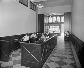 McKeever & Goss, woman working, interior Office ca.  between 1910 and 1935