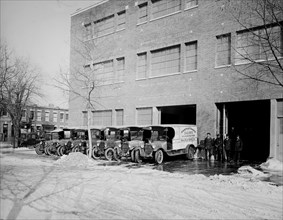 Parked Chestnut Farm Dairy trucks ca.  between 1910 and 1925