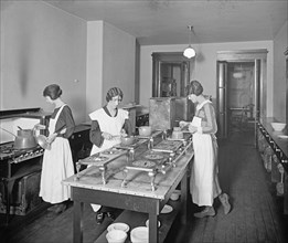 Woman working at the George Washington University kitchen, [Washington, D.C.]. ca.  between 1910 and 1920