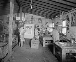 Walling process - Men working on posters in a workshop ca.  between 1910 and 1926