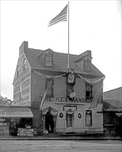 American flag flying over Key Mansion, [Washington, D.C.] ca.  between 1910 and 1935