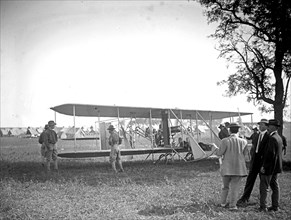 Bi-plane in a field  ca.  between 1910 and 1920
