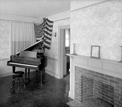 Piano inside a model house ca.  between 1910 and 1925