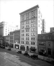Cars parked outside the Wilkins Building in Washington, D.C. ca.  between 1910 and 1920