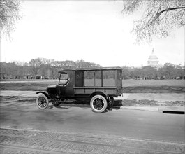 Ford Motor Company new Ford body [U.S. Capitol, Washington, D.C., in background]. ca.  between 1910 and 1920