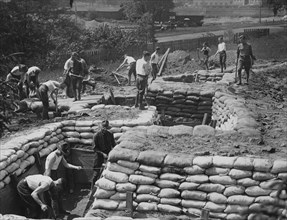 The students of Princeton University, who have enrolled for military service in France, are learning the trade of war in a practical way, building trenches ca.  between 1914 and 1918