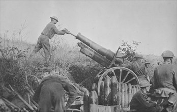 American 155 mm artillery cooperating with the 29th Div. in position on road just taken from the Germans. Battery A 324th artillery, 158th Brigade in France / Signal Corps ca.  1917