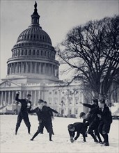 Senate page boys stage their first snow battle on the Capitol plaza ca. 1909