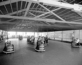 People enjoying a fun day at the Glen Echo, MD amusement park on the bumper cars ride ca.   between 1910 and 1935 (probably 1928)