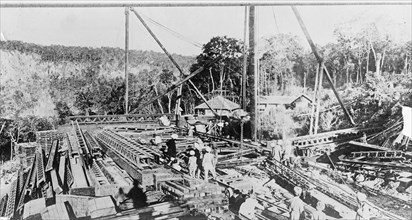 Workers in India working on a bridge ca. between 1909 and 1920