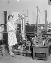 Woman scientist in a laboratory ca. between 1909 and 1923