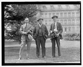 Photographers with cameras in early 20th century ca. between 1909 and 1923