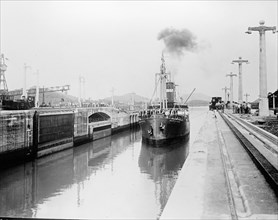 A ship traversing the Panama Canal. Miraflores Lock ca. between 1909 and 1919