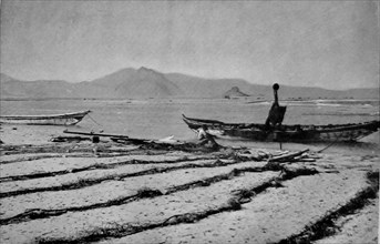 View of  Khor Ghorera (Yemen) in January 1914. Also known as the lagoon, or lake, of Sheikh Said. Several huts are visible across the lake. A  small Turkish garrison occupied Fort Turba at the top of ...