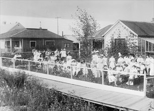 Women and children enjoying a lawn party, Fairbanks, Alaska ca. between 1909 and 1920