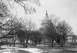 Melting snow outside the U.S. Capitol ca. between 1909 and 1923