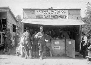 H.E. French, official camp photographer at the National Photo Company booth ca. between 1909 and 1923