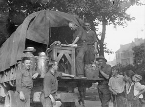 Soldiers unloading a truck ca. between 1909 and 1920