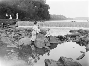 Woman and her children at Great Falls, possibly on the Potomoc River ca. between 1909 and 1923
