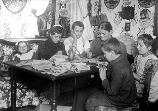 A family in Germany making toys  ca. between 1909 and 1920