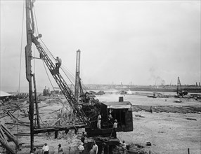 Panama Canal. Men working at the Cristobal leveling station ca. between 1909 and 1919