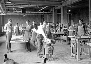 Students in a high school work shop (shop class) ca. between 1909 and 1940