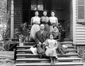 Family photo on the steps of a house in Vienna VA ca. between 1909 and 1923