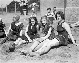 Young women or teen girls in swim suits on a bathing beach ca. between 1909 and 1932