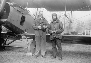 George Creel standing next to an aeroplane ca. between 1909 and 1920