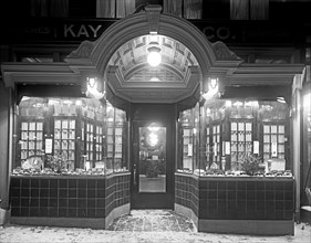 Kay Jewelry Company front windows  at night ca. between 1909 and 1940