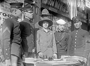 Miss Dora Rodrigues recruiting, World War I, surrounded by men from various branches of the armed forces ca. between 1909 and 1940