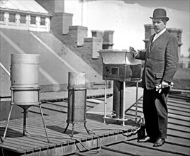 Marvin, Chief of Weather Bureau, on roof with weather instruments ca. between 1909 and 1919