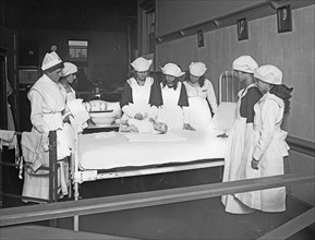 Red Cross education, nurses and students during a home hygiene class, C.H.S. ca. between 1909 and 1940