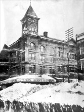 Snow pile & St., Washington., D.C outside the Academy of Music building, ca. between 1909 and 1940