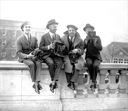 Four Unidentified photographers with cameras ca. between 1909 and 1923