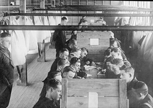 Sailors participate in a Great Lakes Naval training station radio class ca. between 1909 and 1920