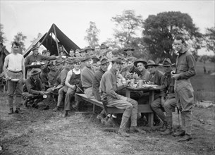 National Guard troops at Harper's Ferry eating a meal, W.Va. ca. between 1909 and 1940