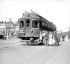 Riders entering a street car in Washington. D.C. ca. between 1909 and 1923