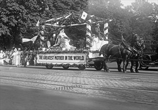 The Greatest Mother in the World float in a Red Cross parade ca.  May 1918