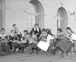 Women knitting, vocational studies public schools ca.  between 1918 and 1920