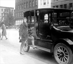 Women taxi driver ca.  between 1918 and 1920