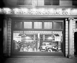 Cadillac Motor Company showroom window at night ca.  between 1918 and 1928
