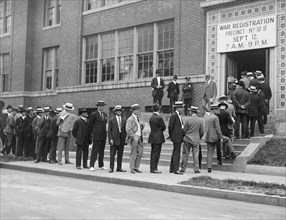 Line of men signing up for draft registration ca.  between 1918 and 1920